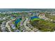 Aerial view of a large residential community with houses, lakes, and conservation areas at 5230 Canyonland Way, Venice, FL 34293