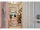 Bright and airy foyer with patterned rug and console table at 5230 Canyonland Way, Venice, FL 34293