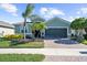 Charming one-story house with a two-car garage and landscaped front yard at 5230 Canyonland Way, Venice, FL 34293