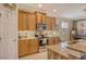 Well-equipped kitchen with ample cabinetry and granite countertops at 5230 Canyonland Way, Venice, FL 34293