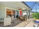 Outdoor patio with seating area, and view into the kitchen at 5230 Canyonland Way, Venice, FL 34293