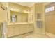 Double vanity bathroom with a large shower and tile floors at 5633 Whispering Oaks Dr, North Port, FL 34287
