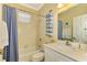 Guest bathroom with tub, shower, and updated vanity at 5633 Whispering Oaks Dr, North Port, FL 34287