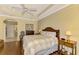 Bright bedroom with hardwood floors and ensuite bathroom access at 5633 Whispering Oaks Dr, North Port, FL 34287