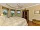 Spacious bedroom with large windows and hardwood floors at 5633 Whispering Oaks Dr, North Port, FL 34287