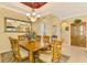 Elegant dining room with wood table and chandelier at 5633 Whispering Oaks Dr, North Port, FL 34287