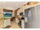 Kitchen boasts stainless steel appliances and granite countertops at 5633 Whispering Oaks Dr, North Port, FL 34287