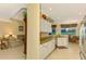 Eat-in kitchen with granite countertops and white cabinets at 5633 Whispering Oaks Dr, North Port, FL 34287