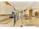 Updated kitchen with granite countertops, stainless steel appliances, and an eat-in area at 5633 Whispering Oaks Dr, North Port, FL 34287