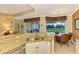 Island kitchen with granite counters and views of the golf course at 5633 Whispering Oaks Dr, North Port, FL 34287