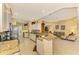 Spacious kitchen with granite countertops and stainless steel appliances at 5633 Whispering Oaks Dr, North Port, FL 34287