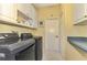 Bright and spacious laundry room with washer and dryer at 5633 Whispering Oaks Dr, North Port, FL 34287