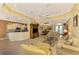 Open living area with kitchen and dining views, neutral tones, and comfortable seating at 5633 Whispering Oaks Dr, North Port, FL 34287