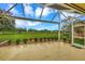 Spacious screened-in patio with golf course view at 5633 Whispering Oaks Dr, North Port, FL 34287