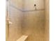 Large tiled shower with built-in bench seat at 5633 Whispering Oaks Dr, North Port, FL 34287