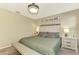 Main bedroom with king-size bed and two nightstands at 5860 Ocean Isle Dr, Nokomis, FL 34275