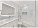 Bathroom with a tiled shower/tub combo and modern vanity at 606 Marcus St # 26, Venice, FL 34285