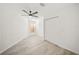 Bedroom featuring wood floors, ceiling fan, and a closet at 606 Marcus St # 26, Venice, FL 34285