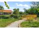 Wooden footbridge over a pond in a community at 606 Marcus St # 26, Venice, FL 34285