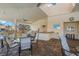 Community patio with tables, chairs, and grill at 606 Marcus St # 26, Venice, FL 34285