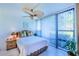 Bedroom with wicker nightstand and garden view at 612 Bird Bay S Dr # 114, Venice, FL 34285
