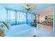 Bedroom with a view of the garden, and access to the living room at 612 Bird Bay S Dr # 114, Venice, FL 34285