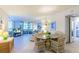 Bright dining area with table and chairs, view to living room at 612 Bird Bay S Dr # 114, Venice, FL 34285