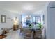 Dining area with table and chairs, view to living room at 612 Bird Bay S Dr # 114, Venice, FL 34285