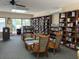 Community library with comfortable seating and extensive collection at 612 Bird Bay S Dr # 114, Venice, FL 34285