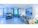 Living room with sofa, access to screened lanai at 612 Bird Bay S Dr # 114, Venice, FL 34285