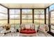 Relaxing screened lanai with wicker furniture, overlooks garden at 612 Bird Bay S Dr # 114, Venice, FL 34285