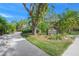Landscaped entrance to Woodside Village East community at 6906 Woodwind Dr # 12, Sarasota, FL 34231