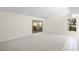 Living room with sliding doors to a patio at 6906 Woodwind Dr # 12, Sarasota, FL 34231