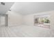 Spacious living room with carpet and sliding glass doors at 6906 Woodwind Dr # 12, Sarasota, FL 34231