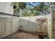 Private patio area with wood fence offering privacy at 6906 Woodwind Dr # 12, Sarasota, FL 34231