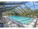 Refreshing community pool under a screened enclosure, perfect for relaxation at 6906 Woodwind Dr # 12, Sarasota, FL 34231
