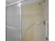 Shower stall with tiled walls and grab bar at 6906 Woodwind Dr # 12, Sarasota, FL 34231
