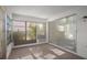 Sunroom with ample natural light and sliding glass doors at 6906 Woodwind Dr # 12, Sarasota, FL 34231