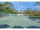 Well-maintained tennis court, ready for your next game at 6906 Woodwind Dr # 12, Sarasota, FL 34231