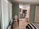 Bedroom with view into bathroom and laundry area at 782 Londra Dr, Venice, FL 34285