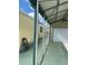 Covered carport with attached garage and side yard access at 782 Londra Dr, Venice, FL 34285