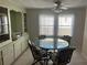 Dining area with glass-top table and four chairs at 782 Londra Dr, Venice, FL 34285