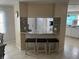 Kitchen with breakfast bar and granite countertop at 782 Londra Dr, Venice, FL 34285