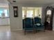 Living area with two armchairs and a view into another room at 782 Londra Dr, Venice, FL 34285