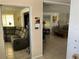 Spacious living room with sectional sofa and large windows at 782 Londra Dr, Venice, FL 34285