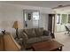 Living room with a couch and view into the kitchen at 782 Londra Dr, Venice, FL 34285