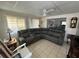 Spacious living room with a large sectional sofa at 782 Londra Dr, Venice, FL 34285