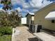 Small patio area with shed and landscaping at 782 Londra Dr, Venice, FL 34285