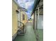Side yard view showing access to home and carport at 782 Londra Dr, Venice, FL 34285