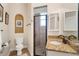 Bathroom features granite countertop, walk-in shower, toilet and fixtures at 793 Vanderbilt Dr, Nokomis, FL 34275
